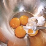 Make chiffon cake egg yolk dough Mix egg yolk with a hand mixer